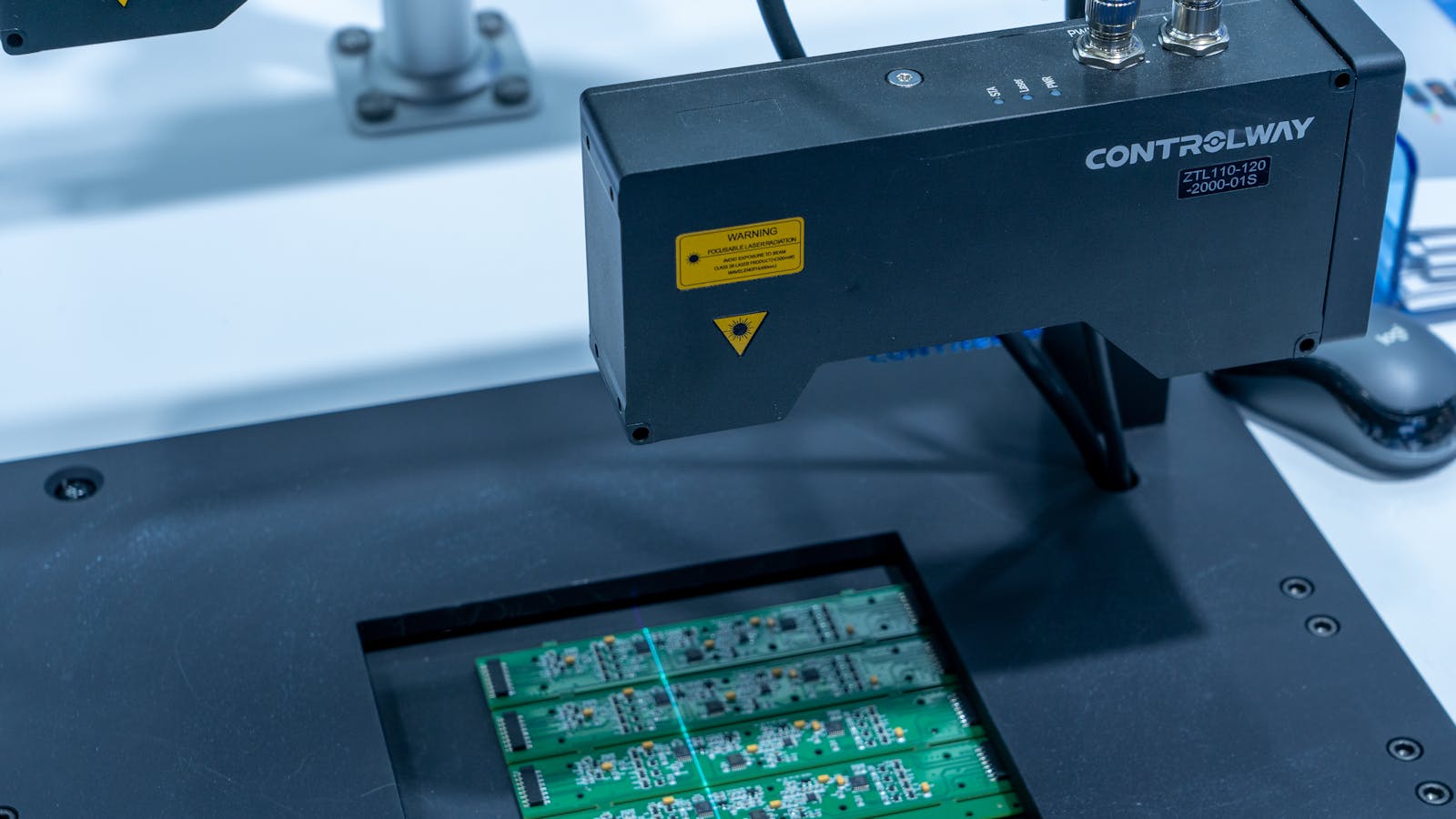Image of inspecting a board at a factory